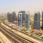 What taxes and fees do you have to pay when purchasing real property in Dubai?